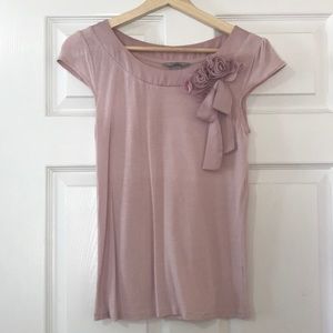 Pink blouse with flower and bow details